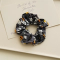 Dark grey Halloween scrunchie with ghost and pumpkin prints on a beige display tray - Skull Ghost Print Large 11cm (Grey)