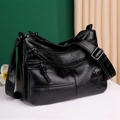 Minimalist black leather crossbody bag with multiple zippers and adjustable strap - Black