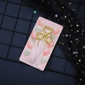 Golden star and heart cake topper candles set on a decorative dark mesh background - Gold