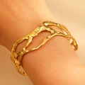 Golden irregular organic branch-like hollow cuff bracelet with textured dots on female wrist - Lava Dot Hollow (7149)