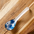 Japanese ceramic soup spoon with blue flower pattern on wood background, size 15.5cm by 4.5cm - Blue Ditsy Floral