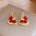 Elegant red rocking horse earrings with gold accents and pearls on champagne satin background - 8# Red Winged Rocking Horse with Zirconia Ear Buckles (Pair)