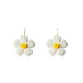Detailed macro view of handmade woven raffia flower earrings in white and yellow - White