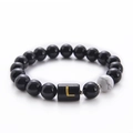 Minimalist black onyx and white turquoise beaded bracelet featuring golden letter L bead - Letter L