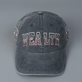 Close-up of vintage washed denim baseball cap with bold WEALTH letter embroidery - L (58-61cm) / Dark Gray