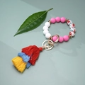 Close-up of colorful silicone beaded keychain with a vibrant triple-layer tassel - Pink White Floral (#2)