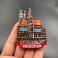 Resin Munich city landmark souvenir magnet with Munchen text in hand display - Munich Germany