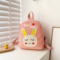 Detailed view of pink canvas toddler backpack with cute rabbit print and top handle - Pink