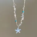 Primer plano detallado del collar de estrella de mar hecho a mano con conchas y perlas - Estilo 6-Blanco (Estrella de Mar Esmalte Concha)