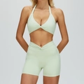 Sage green two-piece yoga set with halter neck top and high-waist twist front shorts - S / Top And Bottom / Bra + Shorts / Mint Green