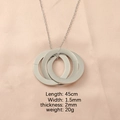 Detail view of interlocking tricolor rings necklace with 45cm chain length and 20g weight - Steel