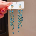 Close-up of S925 silver needle vintage earrings with blue beads and long tassels - Style 45# Silver Pin-Gold-Blue-Green