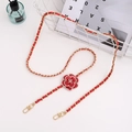 Detailed view of red leather camellia flower with golden metal chain and lobster clasps - Crossbody Chain / Red