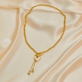 Collana dorata con ciondolo a cuore di perla e nappe di cristallo su seta champagne - Collana di perle del cuore
