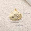 Macro view of a gold-plated seashell pendant with beige enamel and crystals showing dimensions - A0579 Beige Enamel Shell
