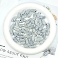 Macro detail of gray ceramic fish beads for DIY jewelry making on white tray - Silver Grey