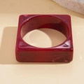 Detail of square wine red acrylic bangle with marble pattern and smooth resin finish - Rose Red