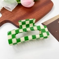 Green and off-white checkered resin hair claw clip displayed on a wooden tray - 10.5cm / Green & Beige Checkerboard