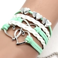 Detail of multi-layer white and mint green woven leather bracelet with silver heart charms - Mint Green Heart Braided Bracelet