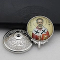Macro detail of metal religious icon box showing Saint Nicholas with greek lettering - Silver-10 (Saint Nicholas)