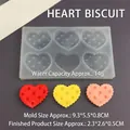 Detail view of 6-cavity heart silicone mold with dimensions and colorful finished cookies - Heart Biscuit / Semi-transparent