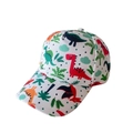 Close-up of kids baseball cap with colorful dinosaur prints and green palm leaf patterns - Forest Dinosaur