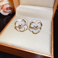 White camellia flower stud earrings with gold trim on an orange jewelry box - Gold/White Camellia (HE28777)
