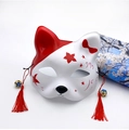 Detail of hand-painted Japanese fox mask with red tassels and bells for Halloween - Red Bow
