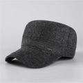 Detailed view of dark grey winter flat cap featuring thick tweed texture and metal logo - Adjustable / Black