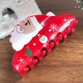Red Christmas hair claw clip with Santa, tree, and snowflake patterns on wood - Red Santa Claus