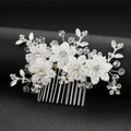Elegant bridal hair comb with white flowers, crystals, and pearls on a silver base - Silver
