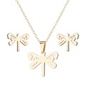 Detail view of a gold dragonfly jewelry set featuring matching necklace and stud earrings - 034 Solid Dragonfly - Gold