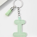 Close-up of light green PU leather letter I keychain with matching fringe tassel - Light Green-Letter I