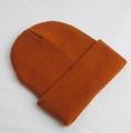 Classic knitted beanie in vibrant orange color with thick ribbed texture for winter warmth - Adult 56-60cm / Caramel color