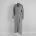 Detail of grey knitted two-piece set showing soft fabric texture of cardigan and maxi dress - Gray