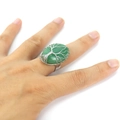 Macro detail of handmade wire-wrapped tree of life ring with green crystal gemstone - Adjustable Open / Oval Green Aventurine