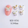Macro detail of cherry butterfly nail charm with gradient rhinestones and white pearls - Aurora Pearl Silver Base Style (MZH-9791)
