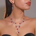 Luxury silver flower necklace and red crystal earrings set worn by a model - Red Floral Style (DTN14026548R)