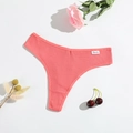 Macro detail of ribbed cotton thong in coral pink with floral and cherry decoration - Pink Red