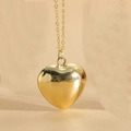 Detail of a polished 3D gold heart pendant on a minimalist chain necklace for women - Extra Large (3.0cm) / Gold