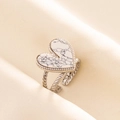 Detail of a 304 stainless steel ring featuring a marble textured heart stone on a twisted band - Silver Tone-White Marble Look (J549-S-W)