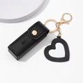 Mini black PU leather lipstick pouch with gold hardware and heart keychain accessory - Black