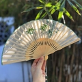 Beige Suzhou silk folding fan with green bamboo embroidery and a matching tassel - Bamboo Shadow