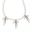 Elegant white pearl necklace with three silver bow pendants made of polished stainless steel - Steel