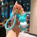 Cute light blue woven texture rabbit keychain featuring a white heart shaped pendant - Rabbit (B255-11) / Single Piece / Green