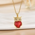 Minimalist owl necklace with a red heart-shaped crystal pendant in a gold-plated finish - Gold Owl/Heart Red Gem