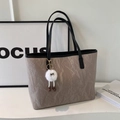Minimalist taupe tote bag with marble texture and black handles and plush charm - With Charm / Gray