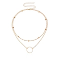 Collier double épaisseur en or rose avec chaîne à billes et pendentif rond ajouré - Doré