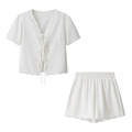 Detail of white two-piece summer set showing V-neck ties and ruffled wavy edges - S / White Pants Set
