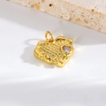 Macro shot of gold irregular heart charm with Love engraving and zircon on stone base - Gold LOVE Textured Heart
